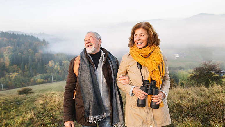an older couple walking in nature