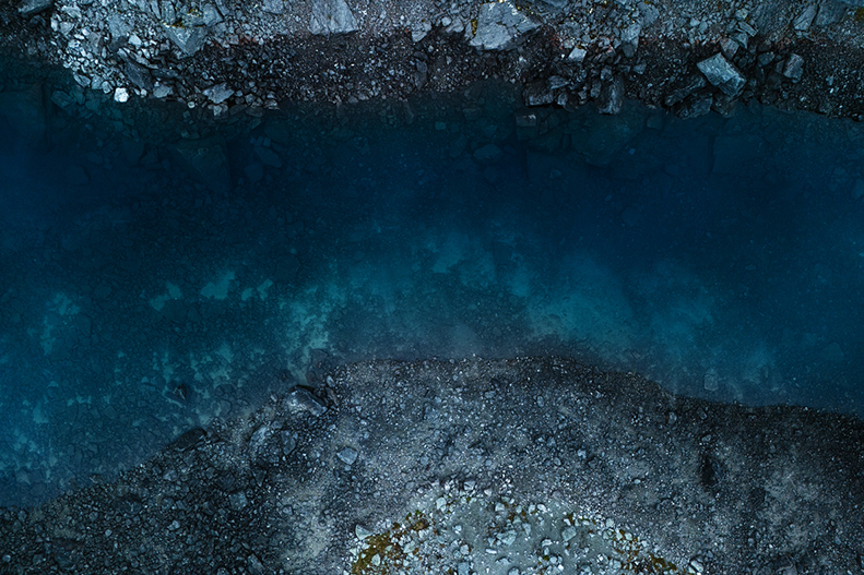 Stunning lake in the mountains. Dramatic landscape. Directly above view. Khibiny, Kola Peninsula, Russia