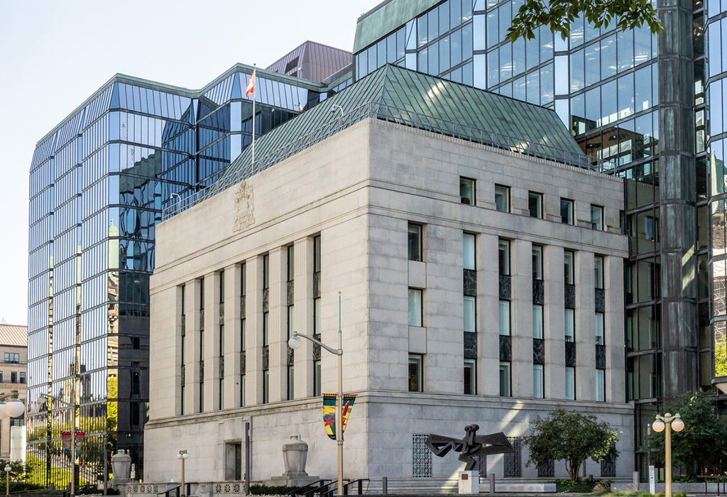 The Bank of Canada headquarters in Ottawa with new glass walls surrounding a historic stone central block