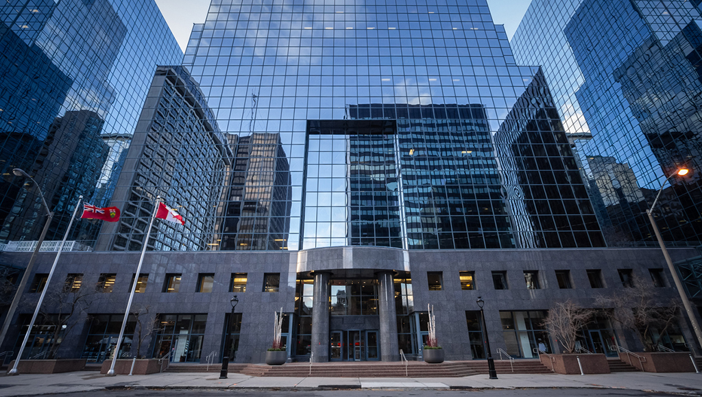 An impressive view of modern skyscrapers in the central business district of Ottawa, Canada. The buildings, with their reflective glass facades, dominate the skyline, highlighting Ottawa's status as a major economic and corporate hub. This image showcases the city's architectural development, emphasizing the presence of corporate offices and business headquarters in Canada's capital. The scene is a testament to the urban growth and economic vitality of Ottawa, serving as a visual representation of the city's business environment.