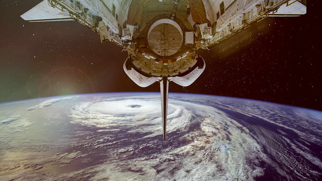 picture of space showing part of a rocket and part of planet Earth