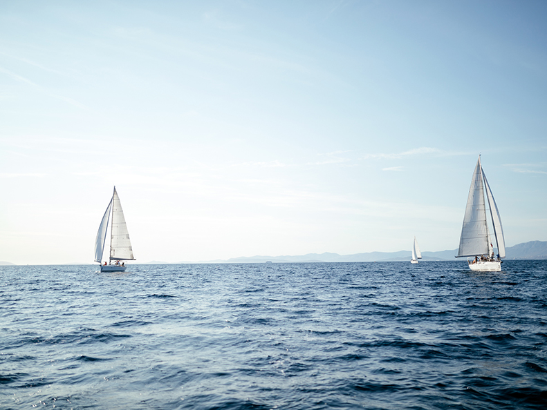Sailing boats ships on open sea