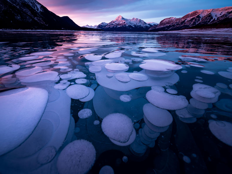 Frozen lake with floating air bubbles