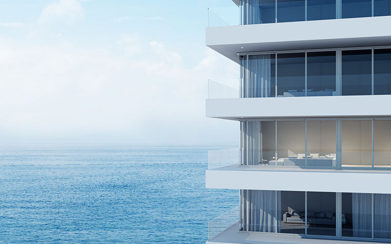 Modern white apartment building by the ocean